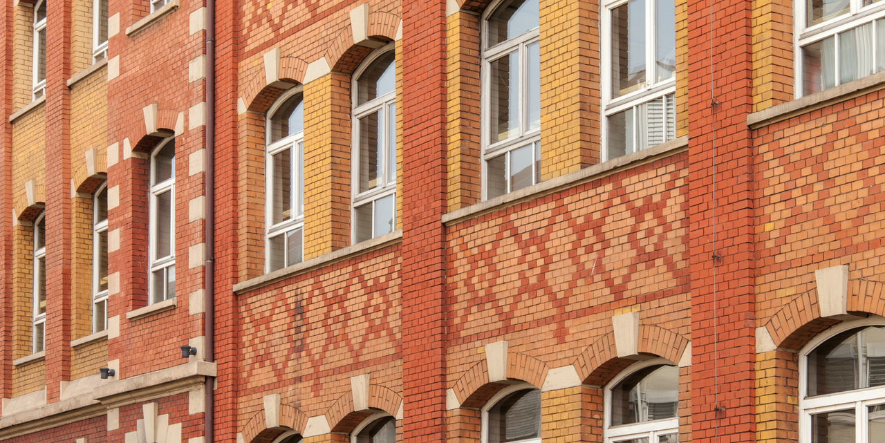 Colour photo: Facade made of red clinker brick by the Rau company on the gymnastics field - copyright:Fotoverlag Günter Beck