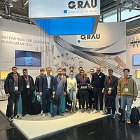 Gruppenfoto am Gemeinschaftsstand von EUROFLEX GmbH und ADMEDES GmbH in Düsseldorf.