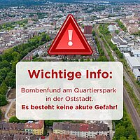 Bild von der Oststadt mit rotem Ausrufezeichen/Warndreieck. Text-Overlay: Wichtige Info: Bombenfund am Quartierspark in der Oststadt. Es besteht keine akute Gefahr!